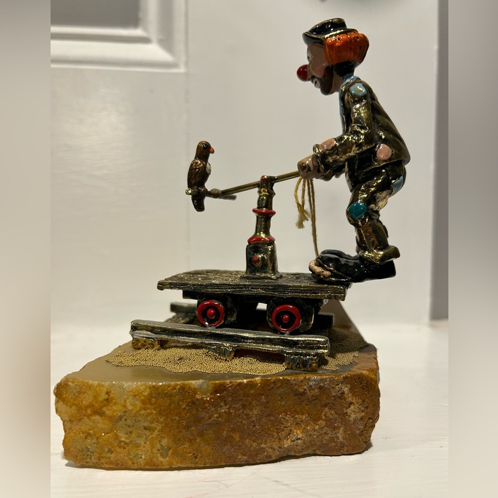 Ron Lee collectible clown on railroad train car.